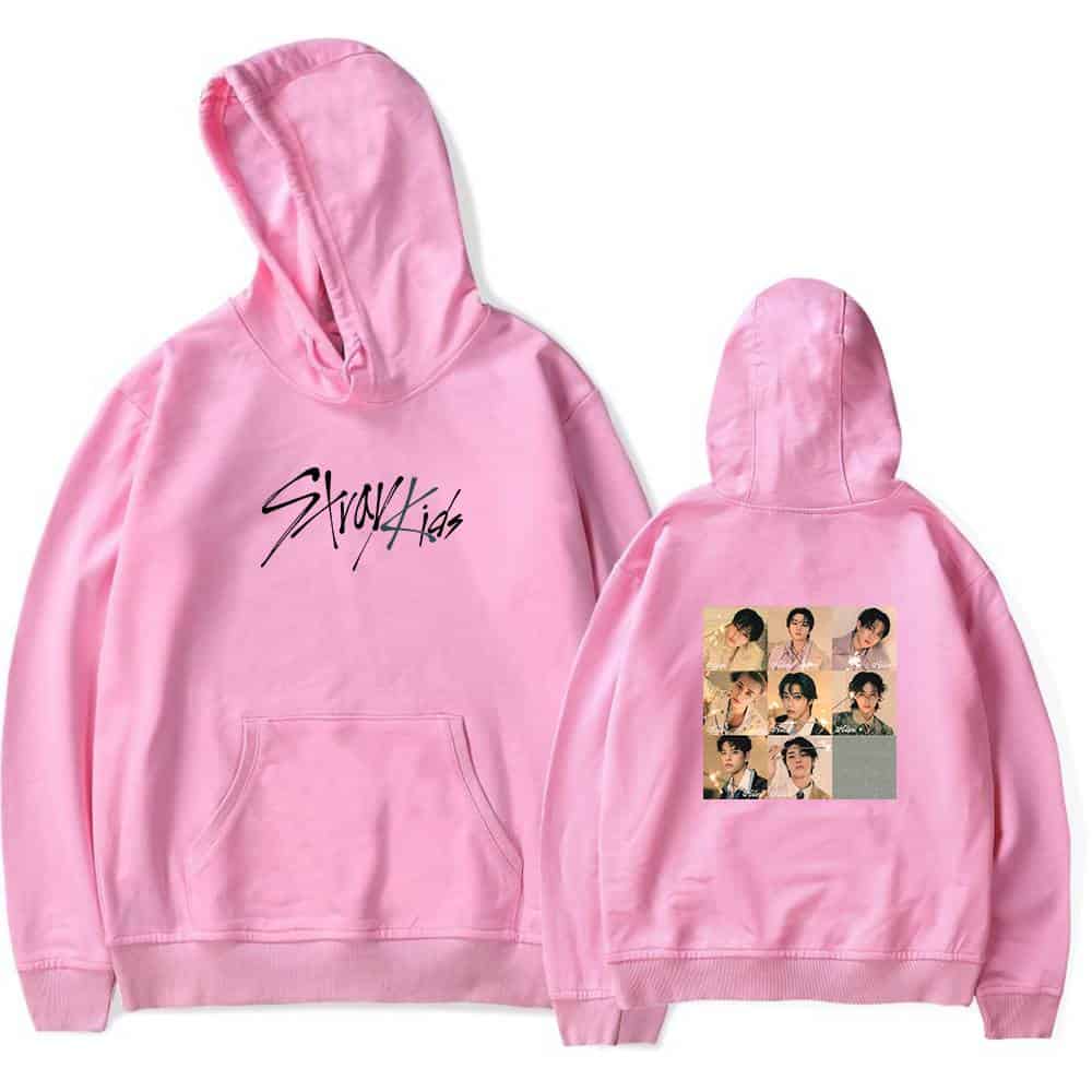 Kpop merch collection featuring a pink hoodie with group photos of a K-pop boy band on the back.
