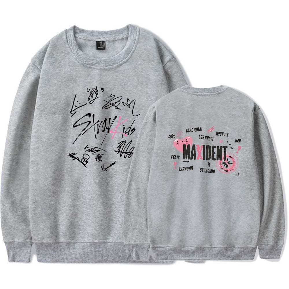 Stylish grey K-pop merchandise sweatshirt featuring signatures and images of the girl group. Perfect for K-pop fans looking to showcase their fandom.