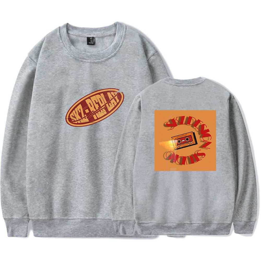 Vintage gray sweatshirt featuring retro cassette tape and bold "K-pop merch" graphic design.