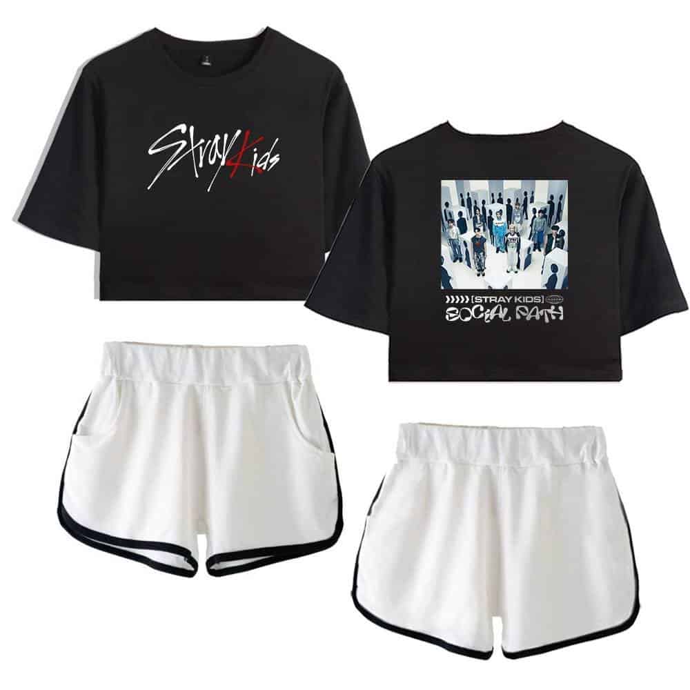 Stray Kids black graphic crop top with band logo design and white athletic shorts.