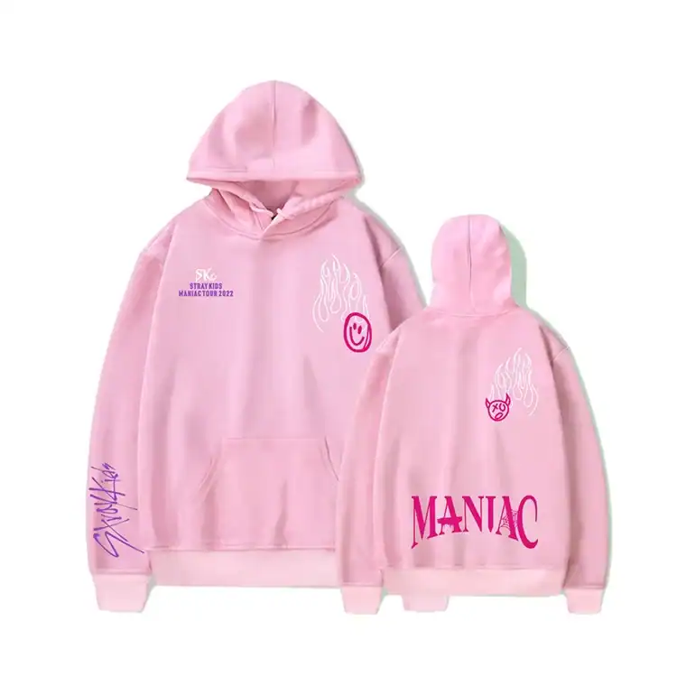 Pink hoodie with smiley face and flames design, Kpop merch, STRAY KIDS MARAC TOUR 2022, MANIAC text, trendy pop star merchandise.